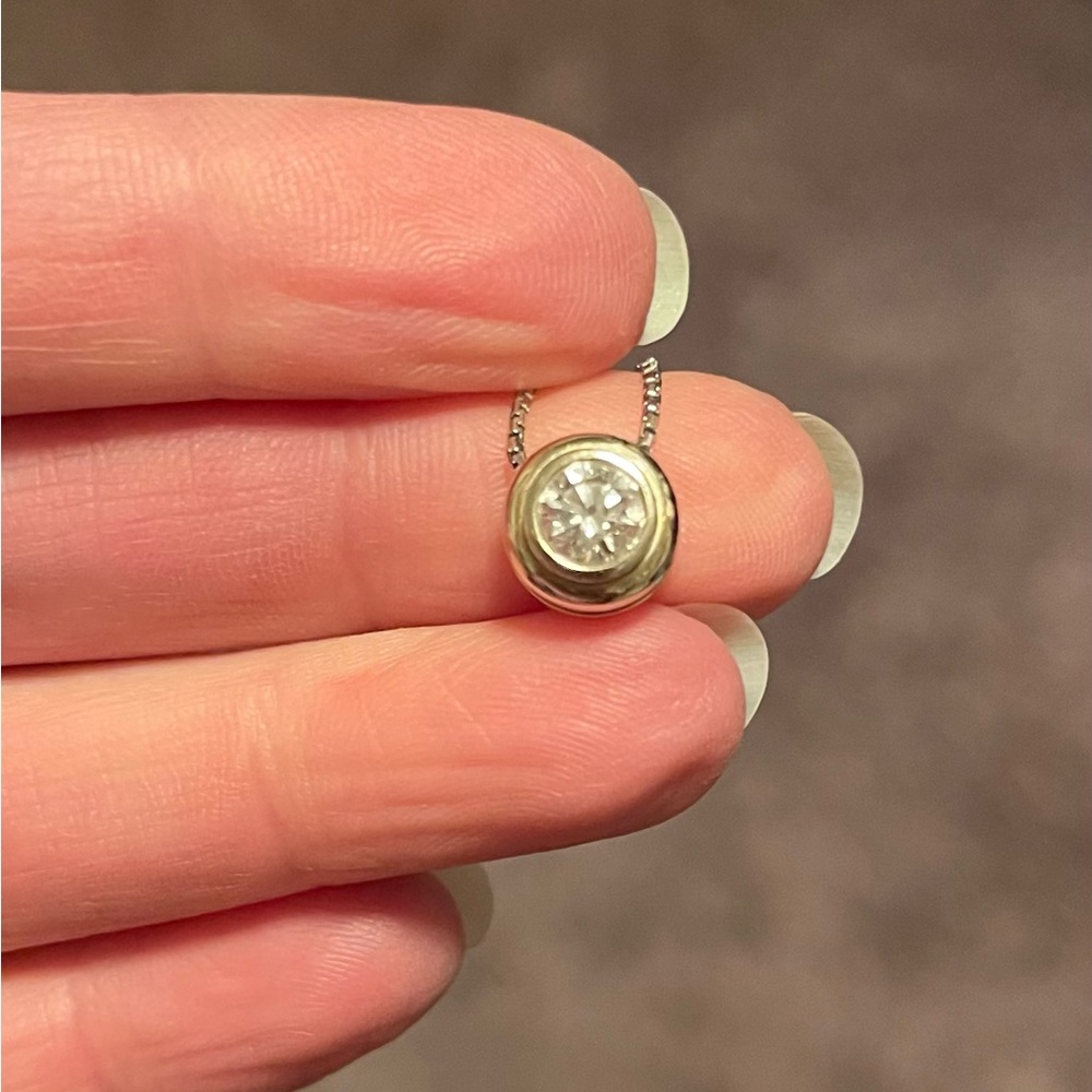 14K white gold bezel-style pendant with .70 ct Diamond